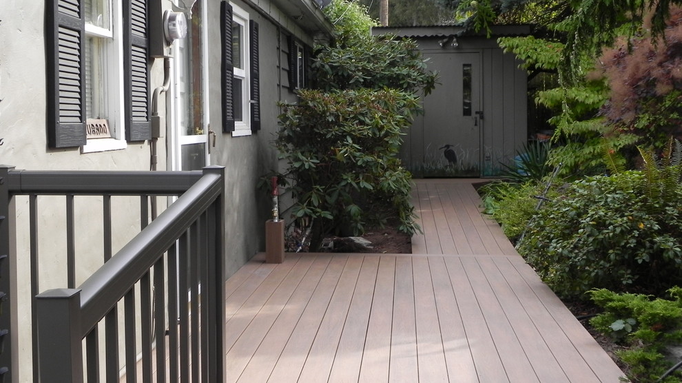 This is an example of a small beach style backyard deck in Seattle.