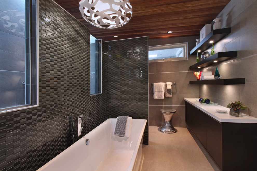 Design ideas for an expansive contemporary master bathroom in Orange County with flat-panel cabinets, black cabinets, a freestanding tub, an open shower, black tile, ceramic tile, grey walls, concrete floors, an undermount sink, engineered quartz benchtops, an open shower and white benchtops.