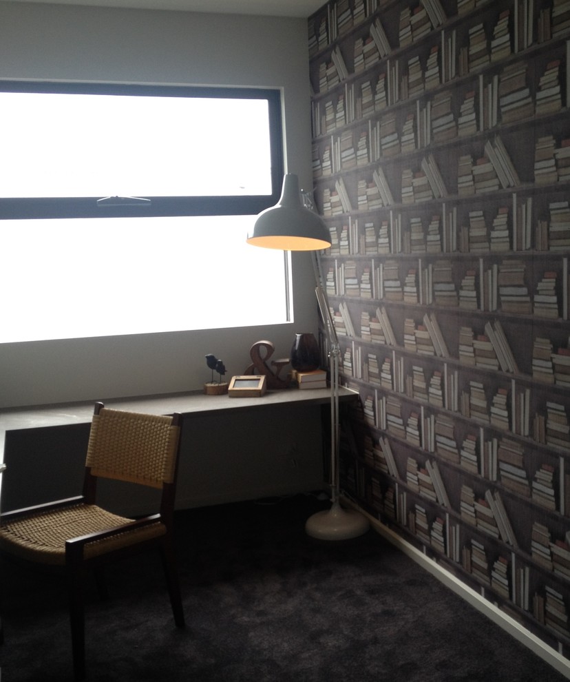 Design ideas for a small modern study room with grey walls, carpet and a built-in desk.