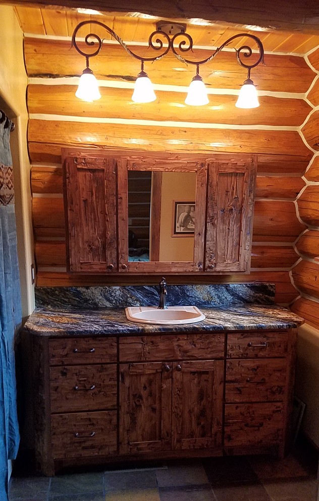 Mountain style bathroom photo with granite countertops