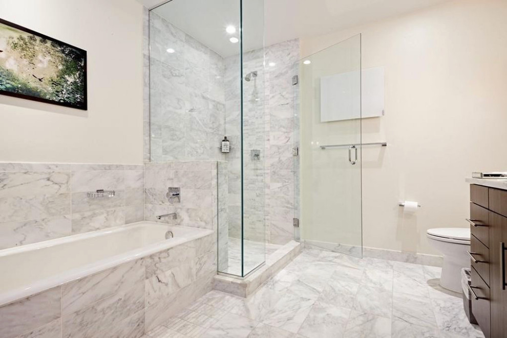 Inspiration for a mid-sized contemporary master white tile and marble tile marble floor, gray floor and double-sink bathroom remodel in Boston with flat-panel cabinets, brown cabinets, a one-piece toilet, white walls, an undermount sink, marble countertops, a hinged shower door, gray countertops and a built-in vanity