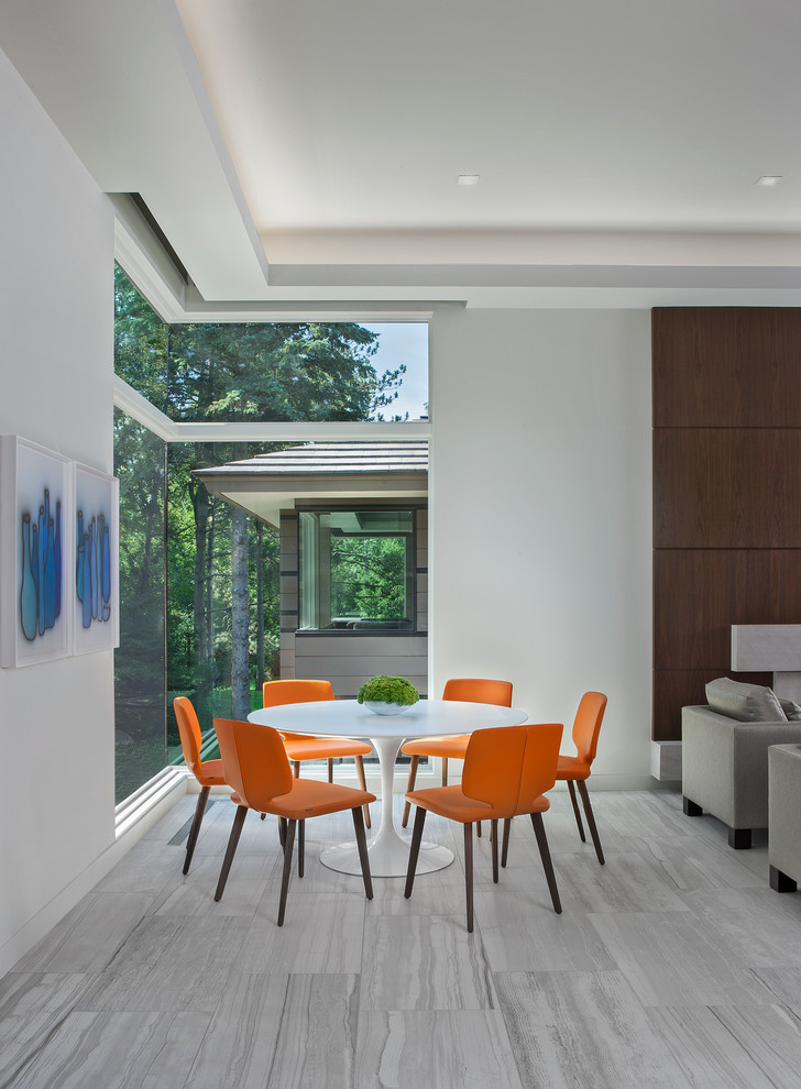 Photo of a contemporary dining room in Detroit with white walls and no fireplace.