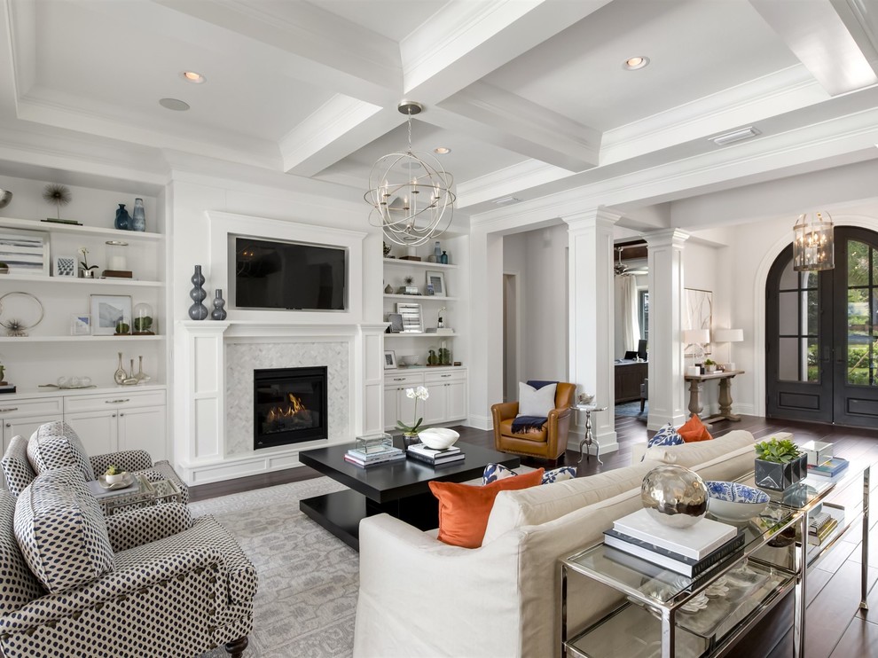 Inspiration for a large transitional enclosed living room in Orlando with white walls, dark hardwood floors, a standard fireplace, a stone fireplace surround and a built-in media wall.