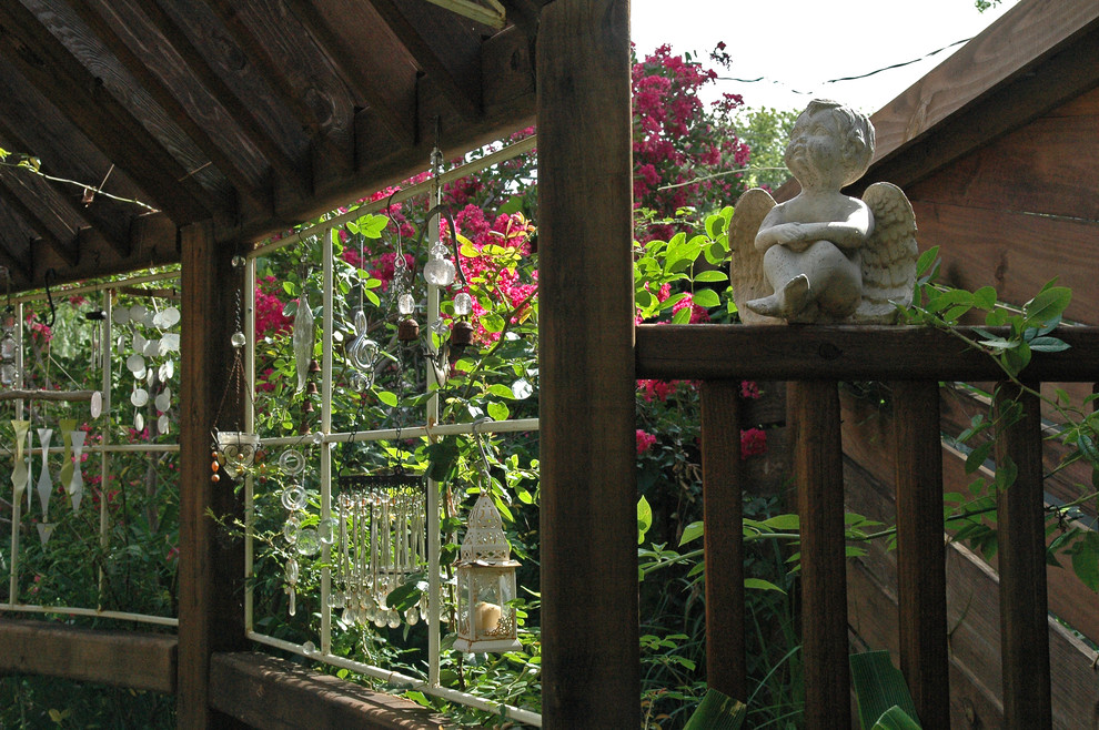 Inspiration for a mid-sized rustic shade backyard formal garden in Austin.