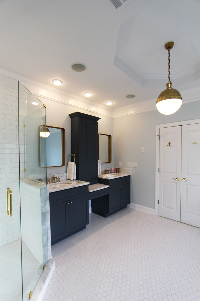 Photo of a large traditional master bathroom in Atlanta with shaker cabinets, blue cabinets, a claw-foot tub, a corner shower, a two-piece toilet, white tile, subway tile, blue walls, mosaic tile floors, an undermount sink and quartzite benchtops.