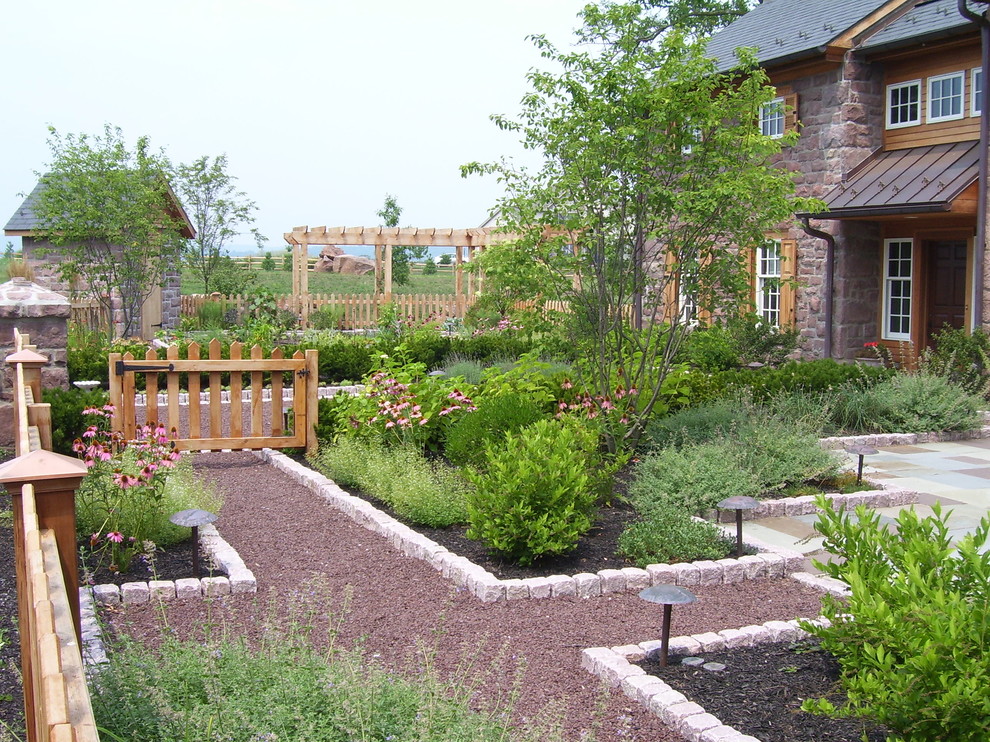 This is an example of a country garden in Philadelphia with gravel.