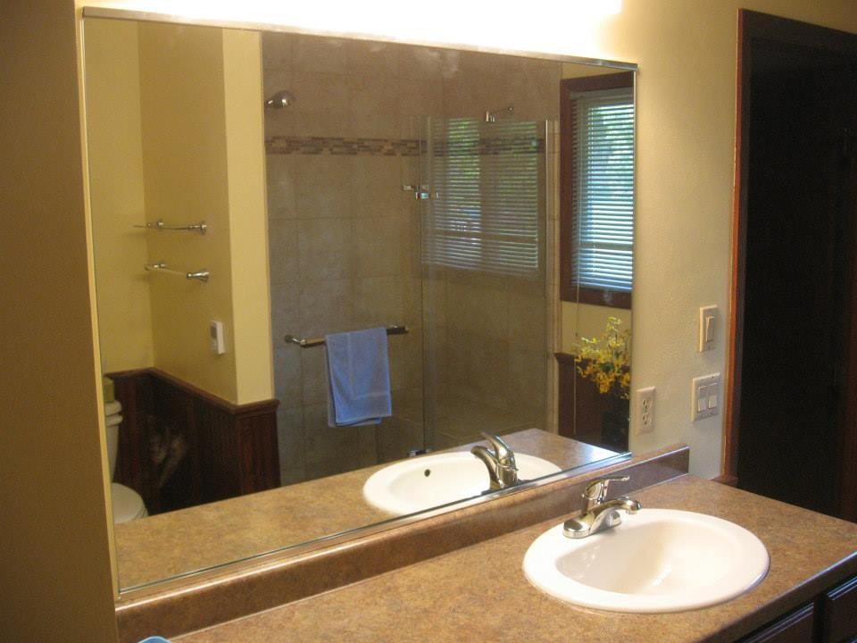 Inspiration for a ceramic tile corner shower remodel with yellow walls