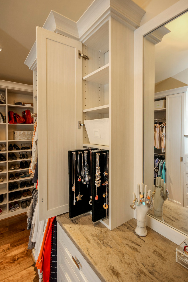 Design ideas for a large transitional gender-neutral walk-in wardrobe in Other with recessed-panel cabinets.