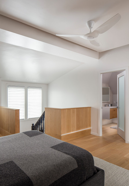From Unfinished Attic to Master Suite moderno-camera-da-letto