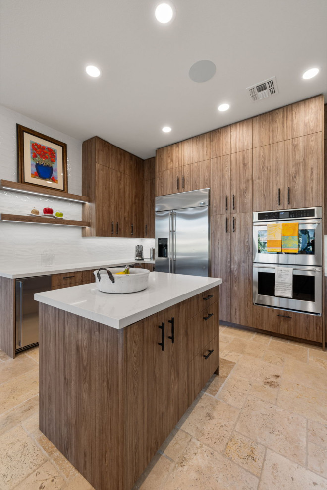 Mountain style l-shaped slate floor and beige floor enclosed kitchen photo with a single-bowl sink, flat-panel cabinets, medium tone wood cabinets, quartzite countertops, white backsplash, glass sheet backsplash, stainless steel appliances, a peninsula and white countertops