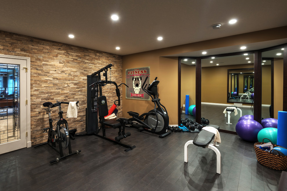 Mid-sized traditional multipurpose gym in Toronto with cork floors and beige walls.