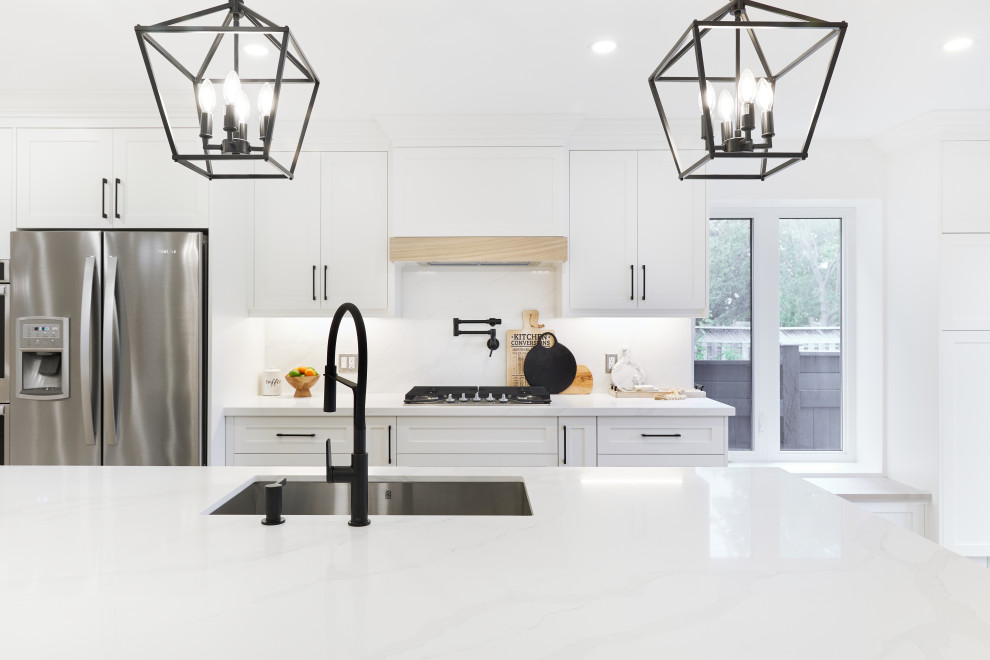 Example of a transitional kitchen design in Toronto