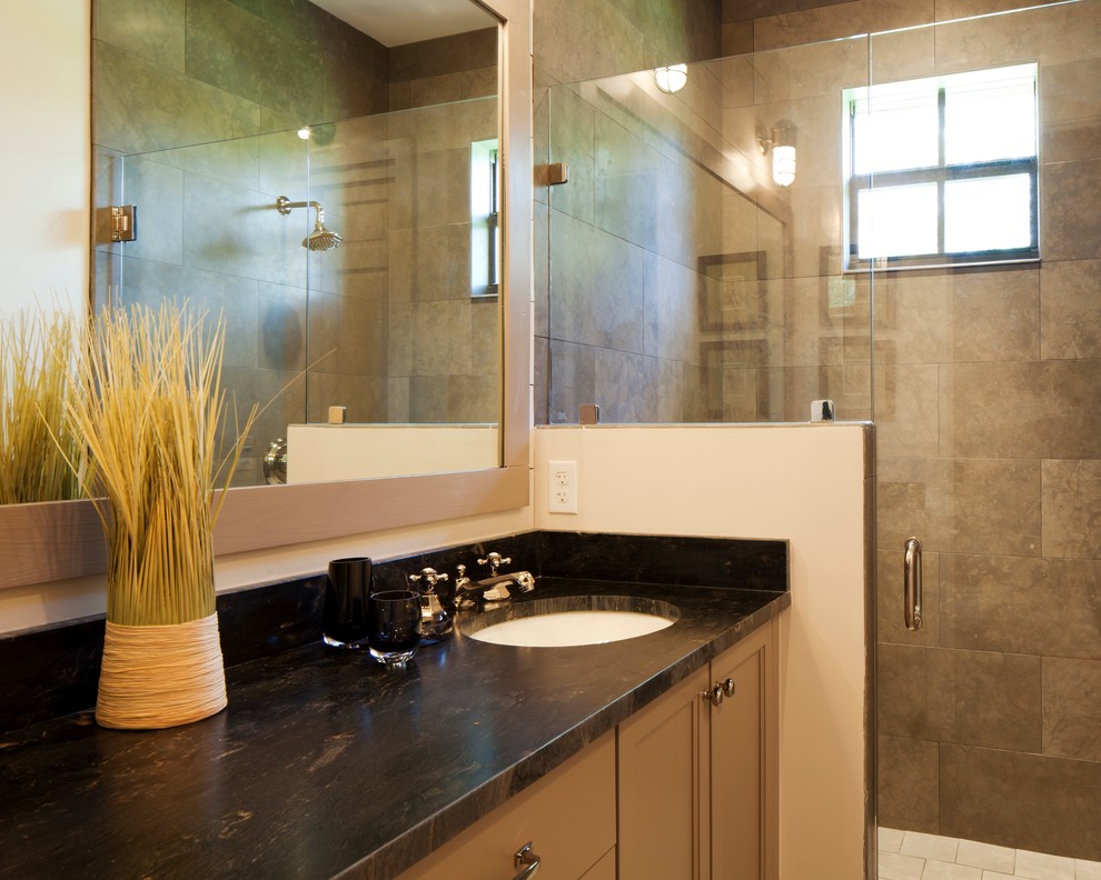 Doorless shower - mid-sized rustic brown tile and stone tile ceramic tile doorless shower idea with a drop-in sink, beige cabinets and white walls