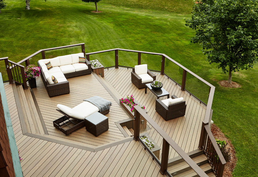 Design ideas for an expansive traditional backyard deck in Other.