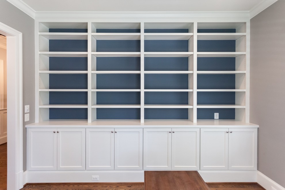 Example of a transitional freestanding desk medium tone wood floor and brown floor home design design in DC Metro with beige walls