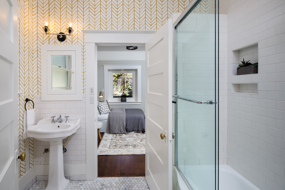 Inspiration for a small transitional 3/4 bathroom in San Francisco with white tile, porcelain tile, white walls, marble floors, a pedestal sink and a sliding shower screen.
