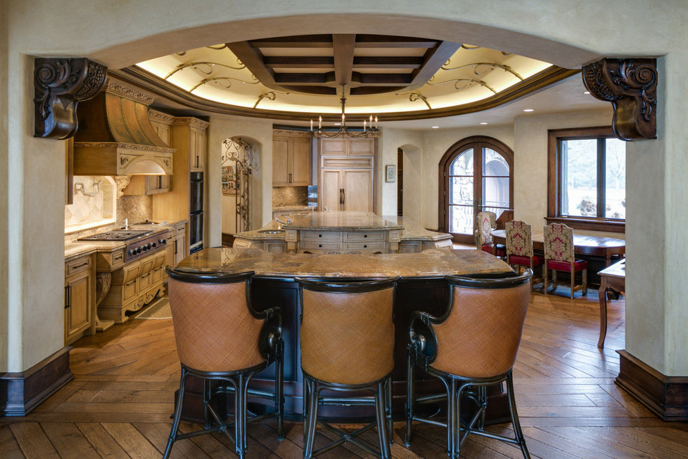 Photo of a traditional eat-in kitchen in Minneapolis with an undermount sink, beaded inset cabinets, light wood cabinets, beige splashback, panelled appliances, multiple islands and dark hardwood floors.