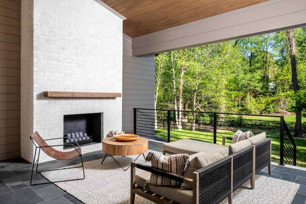 This is an example of a contemporary porch design in Charlotte.