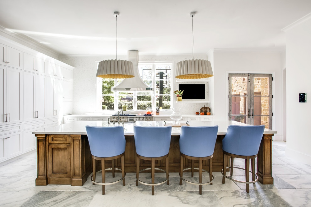 Example of a huge transitional single-wall marble floor open concept kitchen design in Dallas with a farmhouse sink, shaker cabinets, white cabinets, marble countertops, white backsplash, mosaic tile backsplash, stainless steel appliances and an island