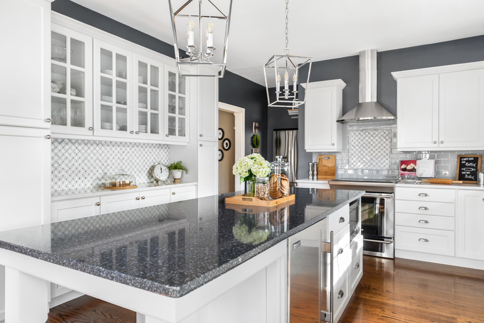Eat-in kitchen - huge transitional l-shaped dark wood floor and brown floor eat-in kitchen idea in Philadelphia with a single-bowl sink, flat-panel cabinets, white cabinets, quartzite countertops, gray backsplash, ceramic backsplash, stainless steel appliances, an island and white countertops