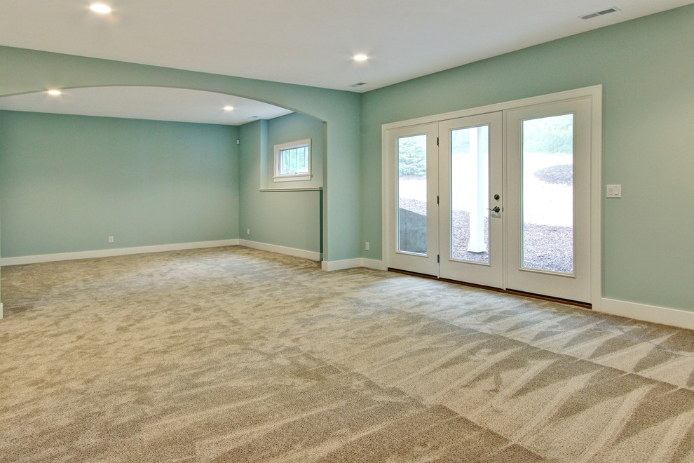 This is an example of a beach style basement in Grand Rapids.
