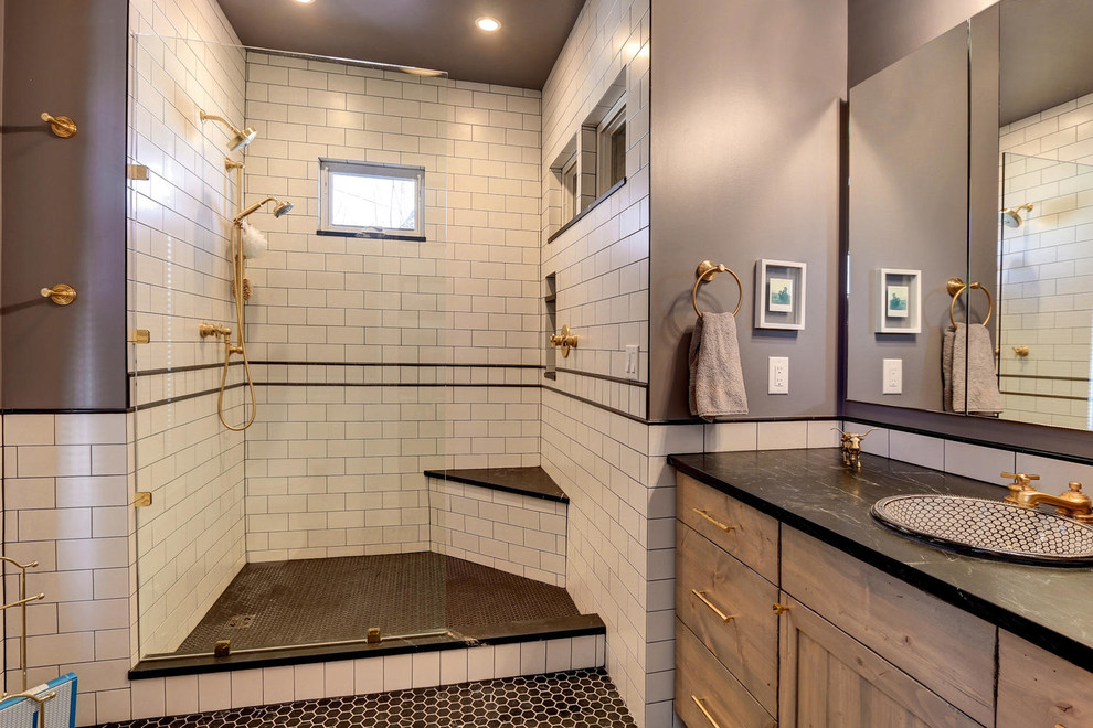 Design ideas for a mid-sized eclectic master bathroom in Denver with shaker cabinets, light wood cabinets, an open shower, a two-piece toilet, subway tile, grey walls, marble floors, a drop-in sink, soapstone benchtops and black and white tile.