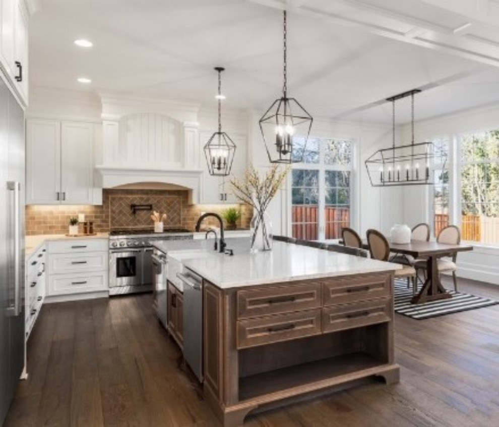 Contemporary eat-in kitchen in San Francisco with shaker cabinets, white cabinets, quartz benchtops, brick splashback, stainless steel appliances, dark hardwood floors, with island and white benchtop.