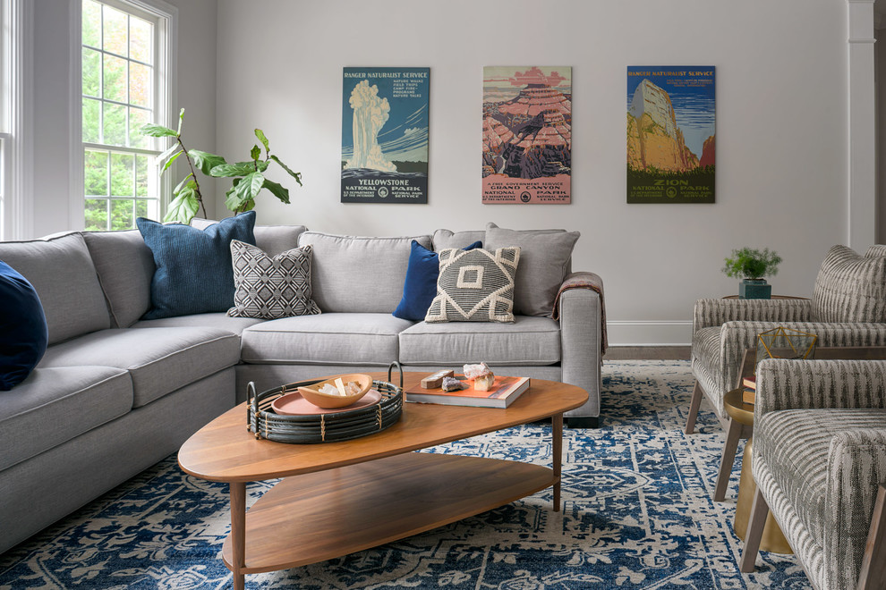 Example of a mid-sized transitional open concept dark wood floor and brown floor family room design in Nashville with gray walls