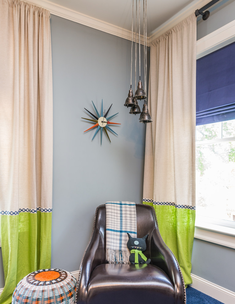 Photo of a mid-sized transitional kids' room for boys in Atlanta with blue walls, carpet and blue floor.