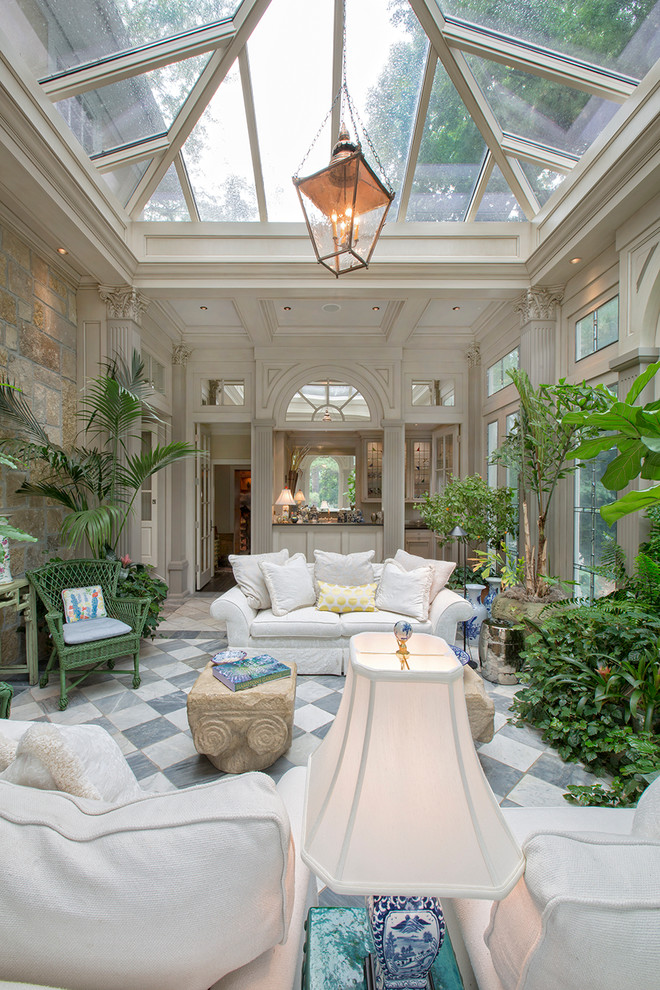 Inspiration for a large traditional enclosed family room in Omaha with white walls and marble floors.