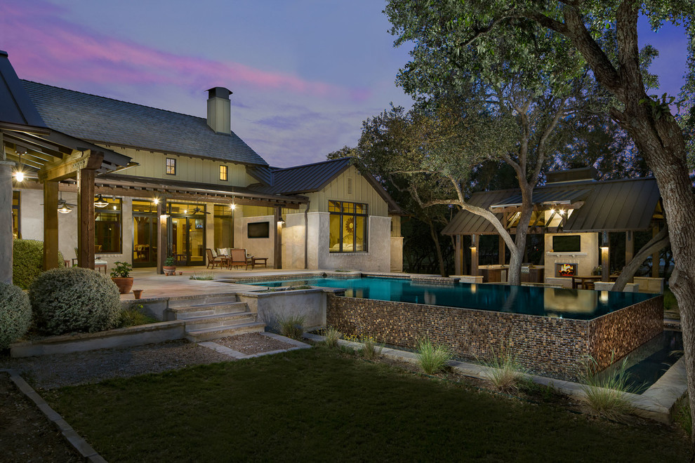 Mid-sized country two-storey exterior in Austin.