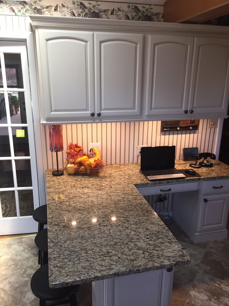 Inspiration for a small transitional l-shaped eat-in kitchen remodel with raised-panel cabinets, beige cabinets, granite countertops and a peninsula