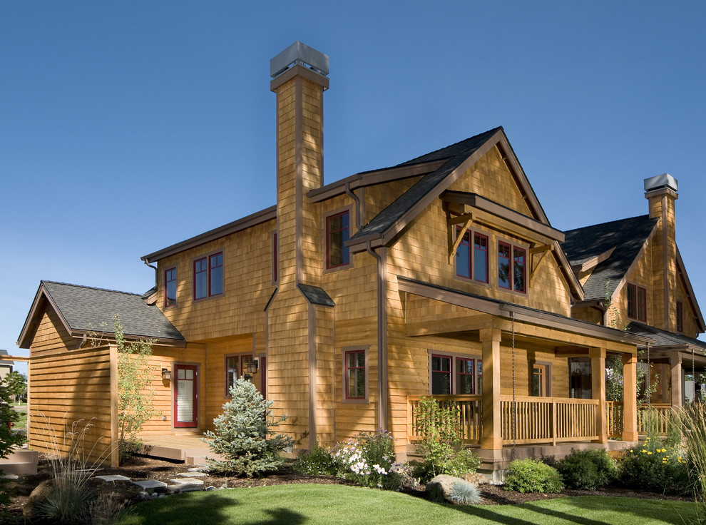 Design ideas for a traditional two-storey exterior in Seattle with wood siding and a gable roof.