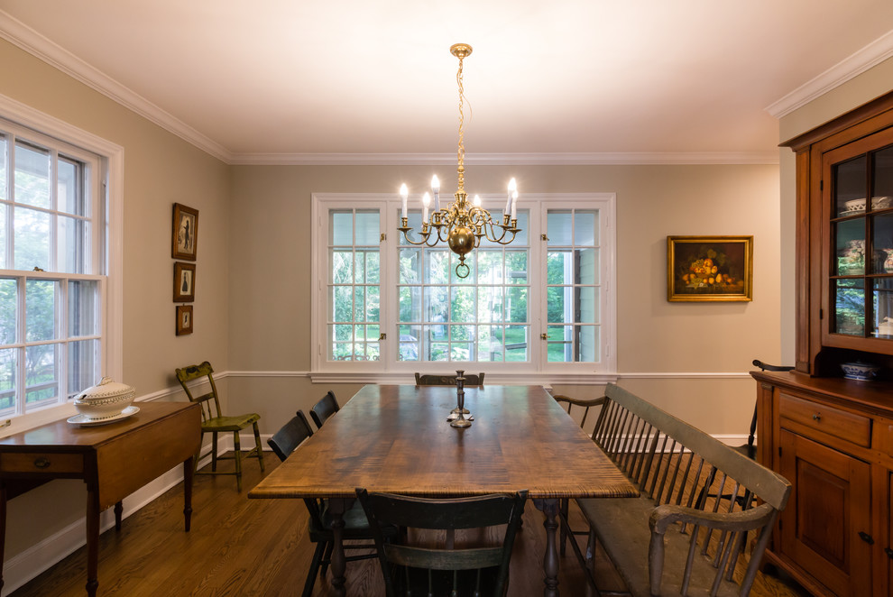 Design ideas for a traditional separate dining room in Boston with beige walls, medium hardwood floors, no fireplace and brown floor.