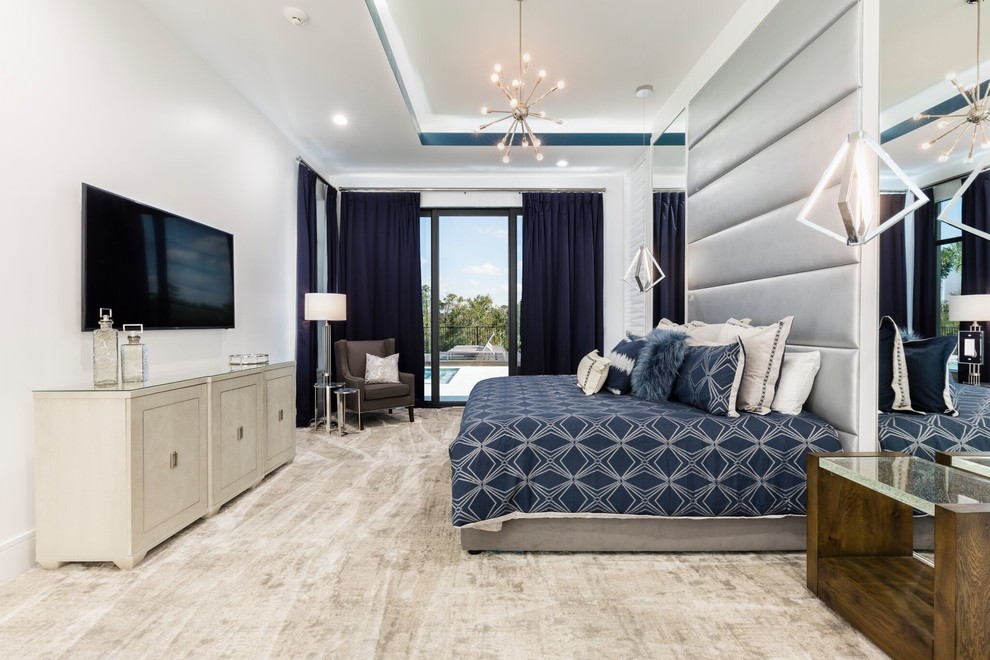 Zimmerman Residence - This Master bedroom is infused with navies and a beautiful custom vinyl headboard with led lit trey ceilings to compliment the all over aesthetic.
