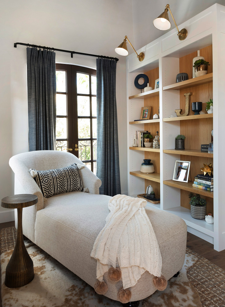 Bedroom - large mediterranean loft-style medium tone wood floor, brown floor and vaulted ceiling bedroom idea in Orange County