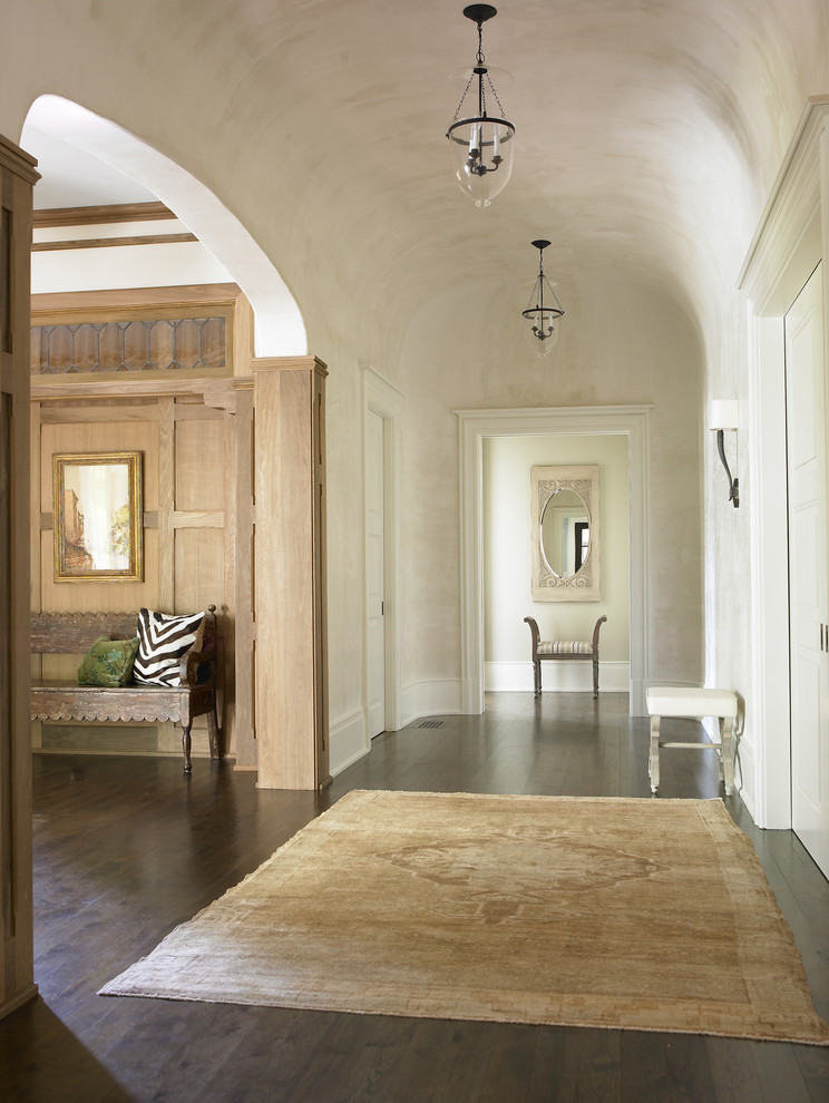 Inspiration for a large traditional foyer in Atlanta with beige walls and dark hardwood floors.