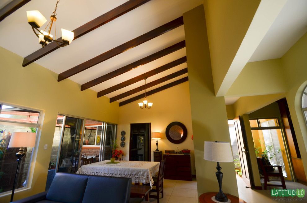 Example of a mid-sized mountain style formal and open concept porcelain tile home design design with yellow walls, no fireplace and no tv