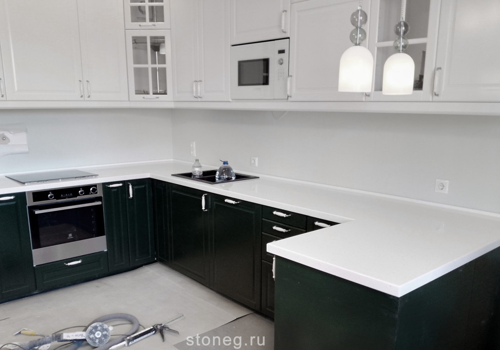 This is an example of a large contemporary u-shaped eat-in kitchen in Saint Petersburg with a drop-in sink, glass-front cabinets, white cabinets, solid surface benchtops, no island and white benchtop.