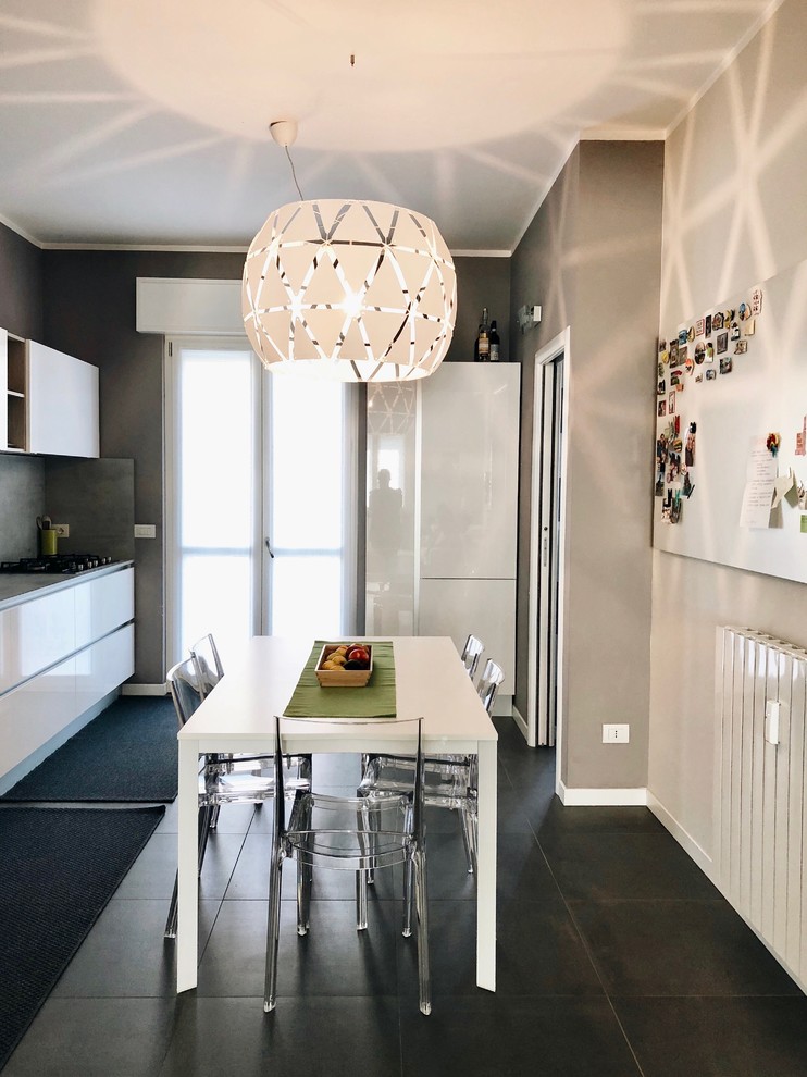 This is an example of a contemporary dining room in Milan.