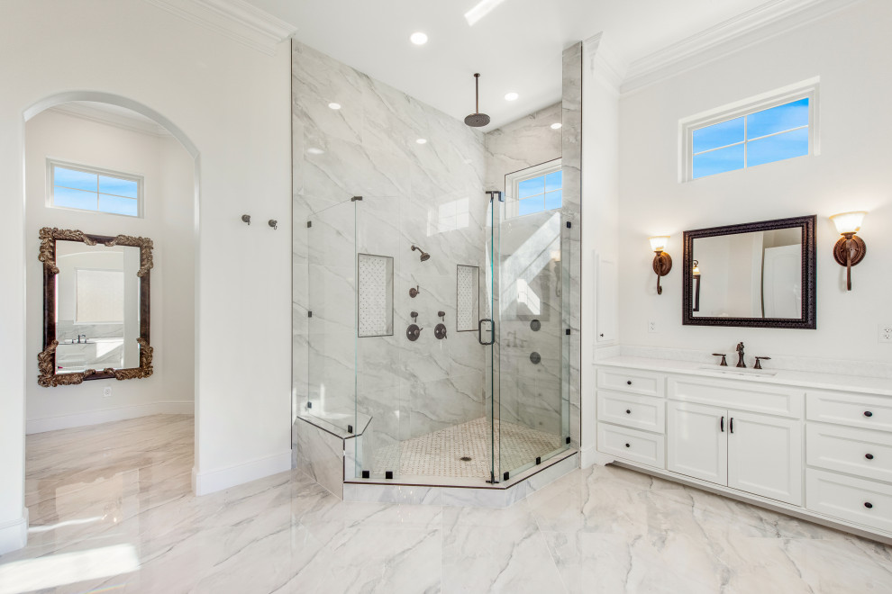 Inspiration for a large master bathroom in Dallas with recessed-panel cabinets, white cabinets, an alcove tub, a curbless shower, a two-piece toilet, gray tile, porcelain tile, white walls, porcelain floors, an undermount sink, quartzite benchtops, grey floor, a hinged shower door, white benchtops, an enclosed toilet, a single vanity and a built-in vanity.