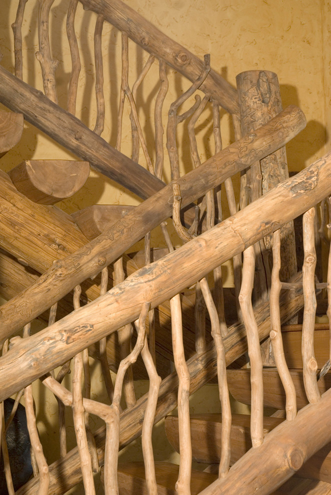 Mid-sized mountain style wooden floating wood railing and open staircase photo in Denver