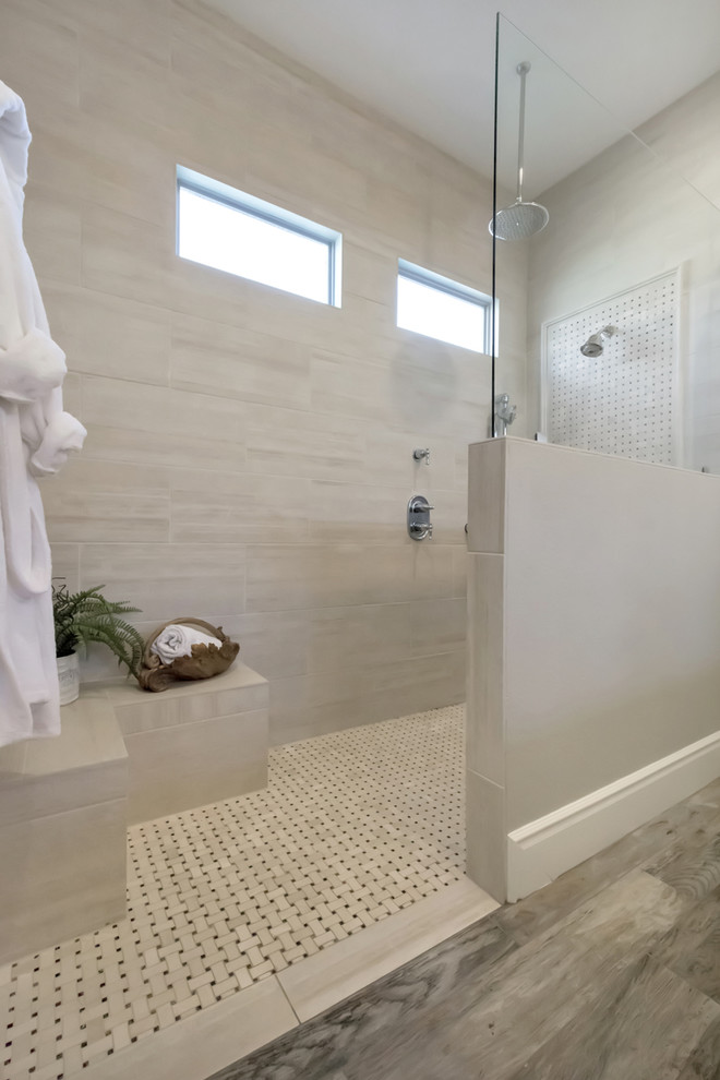 Inspiration for a mid-sized traditional master bathroom in Phoenix with raised-panel cabinets, black cabinets, a curbless shower, a one-piece toilet, beige tile, porcelain tile, grey walls, porcelain floors, a drop-in sink, quartzite benchtops, grey floor and an open shower.