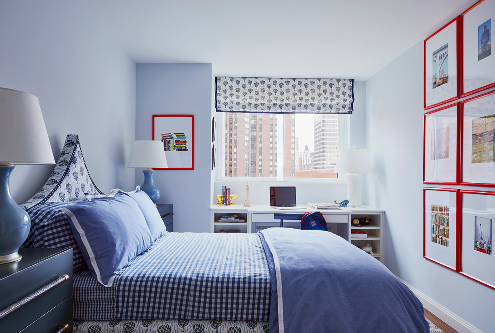 Photo of a mid-sized transitional guest bedroom in New York with blue walls, brown floor, no fireplace and medium hardwood floors.