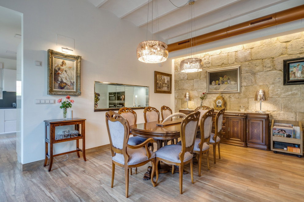 Large contemporary open plan dining in Alicante-Costa Blanca with beige walls, medium hardwood floors, a wood stove, a metal fireplace surround, brown floor and planked wall panelling.