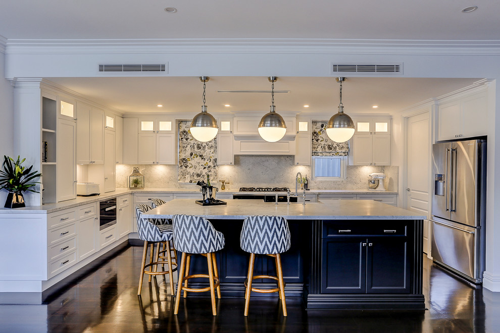 Inspiration for a large transitional u-shaped eat-in kitchen in Perth with a farmhouse sink, recessed-panel cabinets, white cabinets, marble benchtops, white splashback, black appliances, dark hardwood floors and with island.