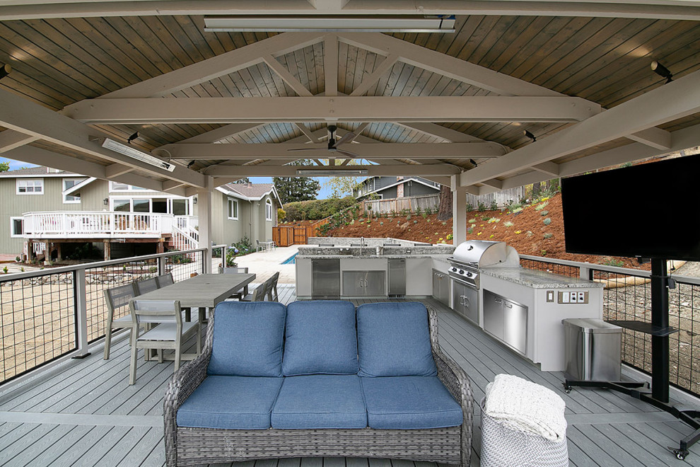Photo of a large transitional side yard patio in San Francisco with an outdoor kitchen, decking and a gazebo/cabana.