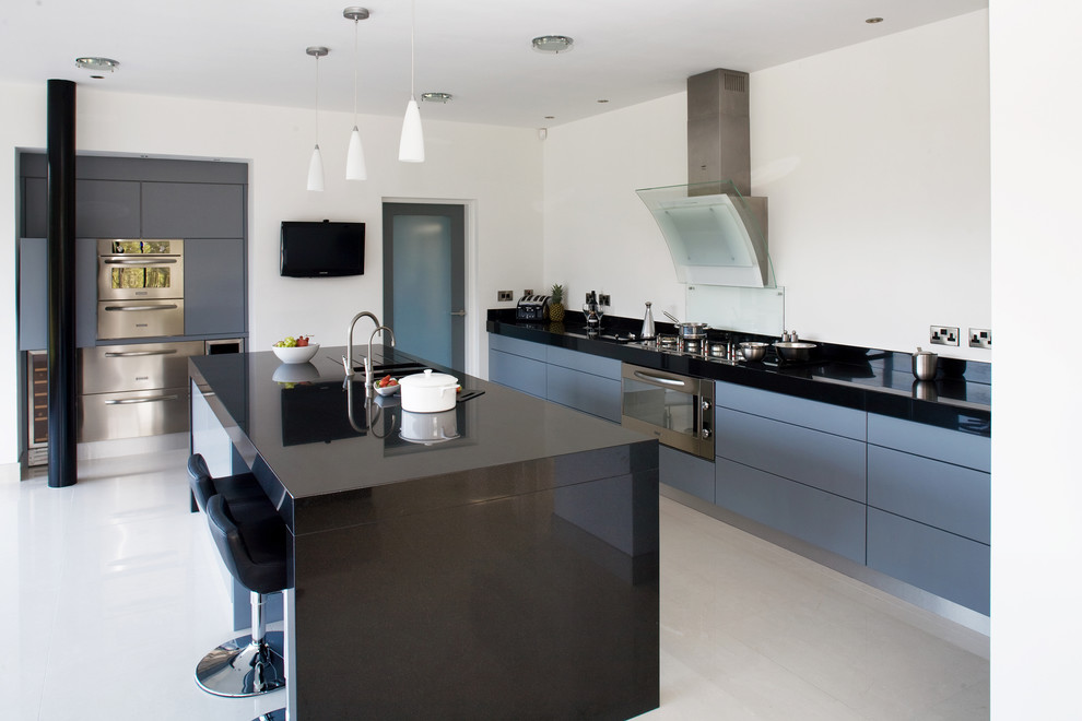 Inspiration for a contemporary kitchen in Other with stainless steel appliances and grey cabinets.