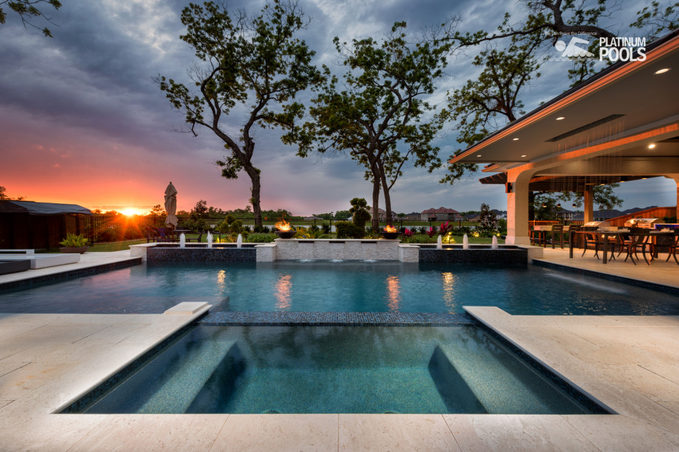 Contemporary backyard custom-shaped pool.