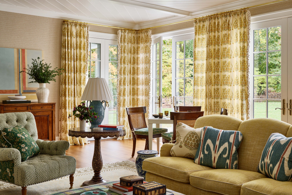 Rye Colonial - Example of a classic medium tone wood floor, brown floor and wallpaper family room design in New York with beige walls